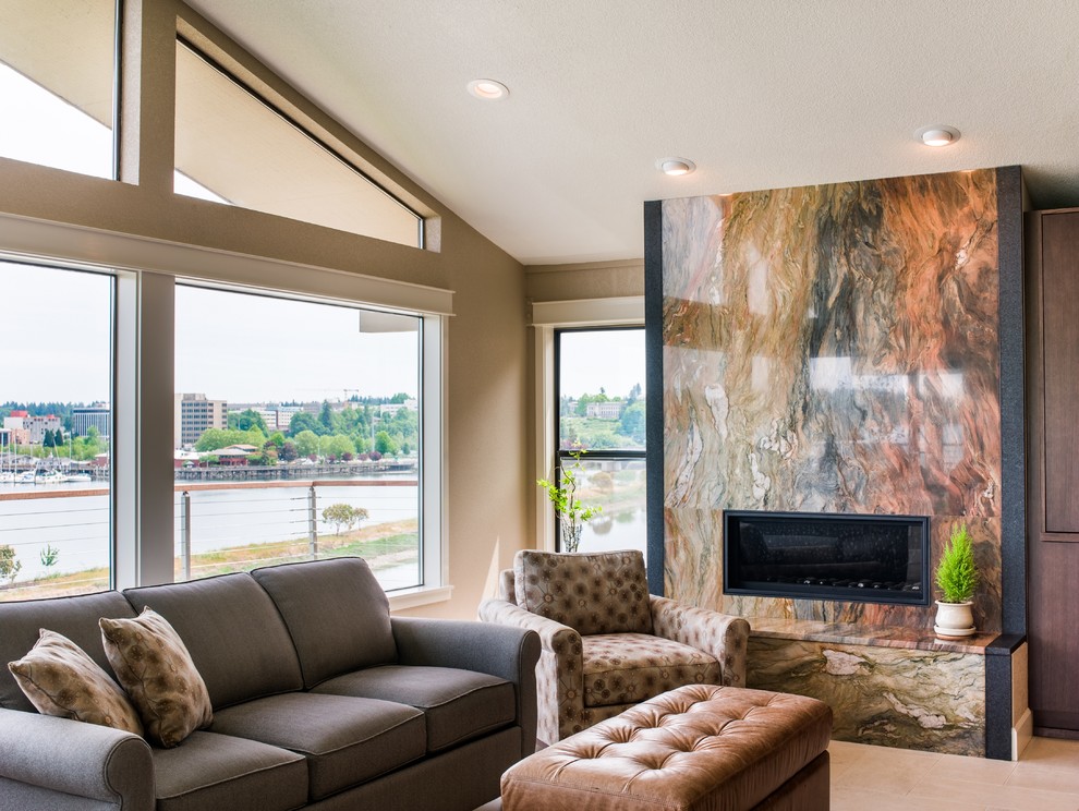 Mid-sized transitional open concept living room in Seattle with beige walls, porcelain floors, a ribbon fireplace, a stone fireplace surround and a concealed tv.