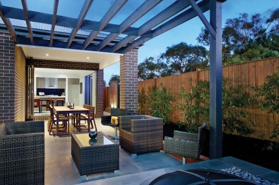 Photo of a small contemporary backyard patio in Melbourne with a fire feature, tile and a pergola.