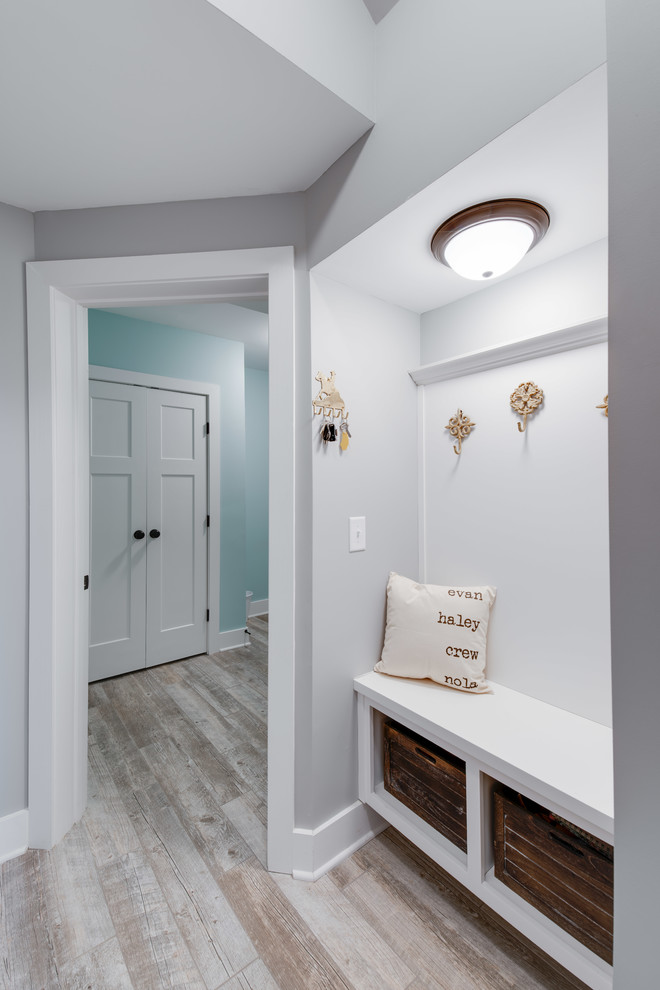 Example of a mid-sized transitional porcelain tile and multicolored floor mudroom design with gray walls