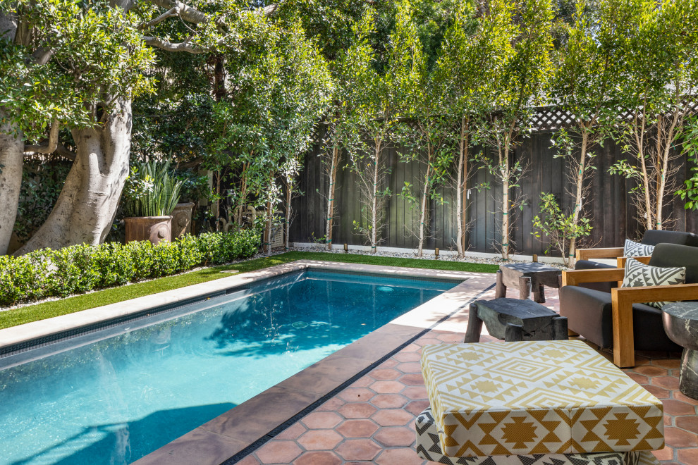 Inspiration for a medium sized mediterranean back rectangular lengths swimming pool in Los Angeles with tiled flooring.