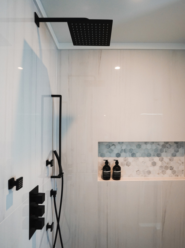 Example of a small minimalist 3/4 white tile and porcelain tile porcelain tile, gray floor and double-sink bathroom design in Vancouver with white walls, granite countertops, a hinged shower door and white countertops