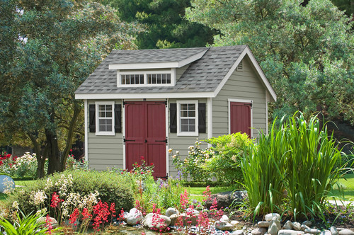 Simple shed with dusky red doors.
