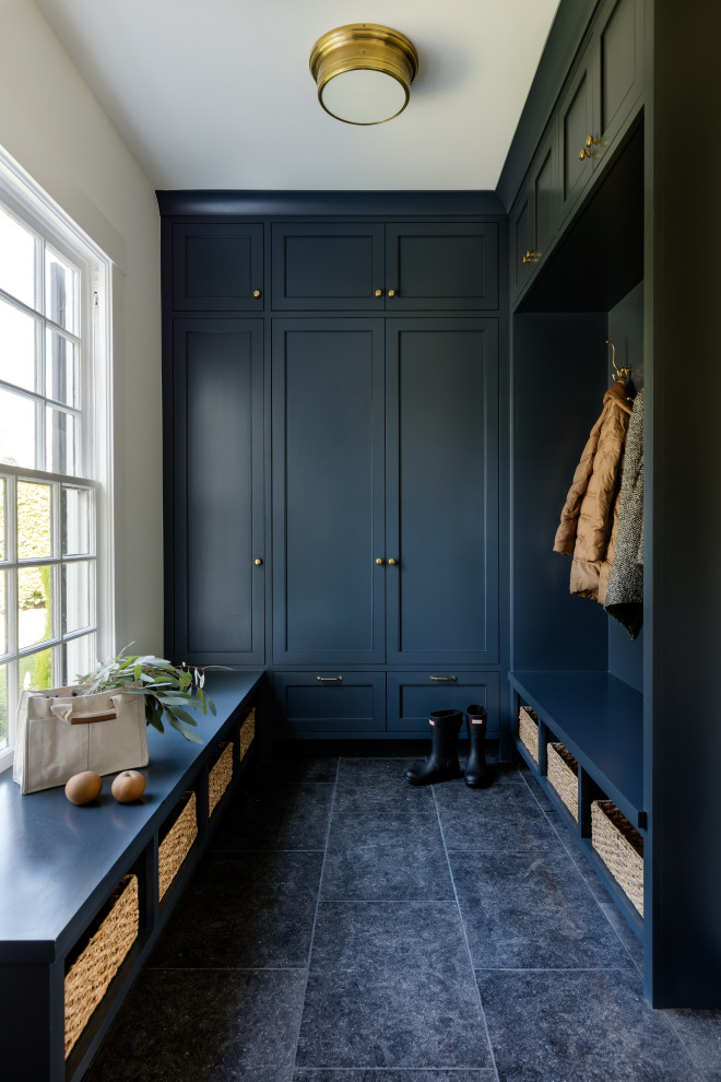 Inspiration for a large transitional mudroom in Seattle with white walls, limestone floors, a single front door, a white front door and black floor.