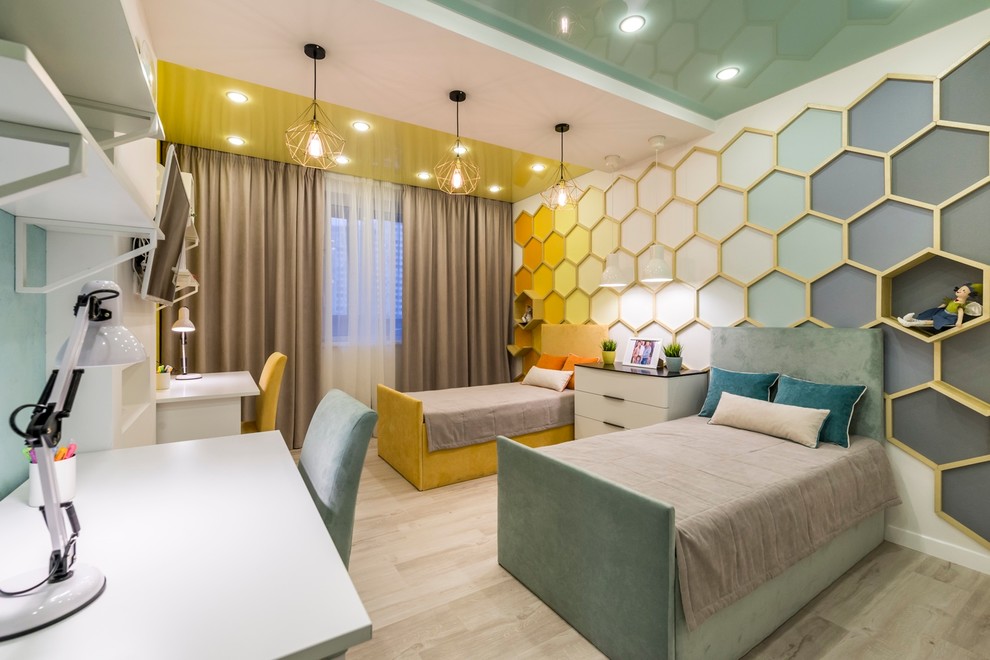 Photo of a mid-sized contemporary kids' room for girls in Moscow with multi-coloured walls and light hardwood floors.