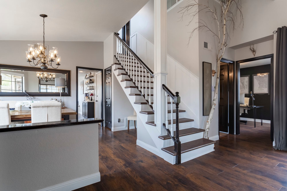 Example of a mid-sized transitional painted straight wood railing staircase design in Los Angeles with painted risers