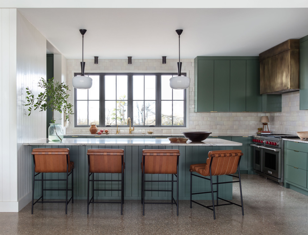 Martindale Water Ski Retreat - Kitchen - mid-sized contemporary galley concrete floor kitchen idea in Austin with an undermount sink, flat-panel cabinets, green cabinets, quartzite countertops, white backsplash, terra-cotta backsplash, stainless steel appliances, a peninsula and beige countertops