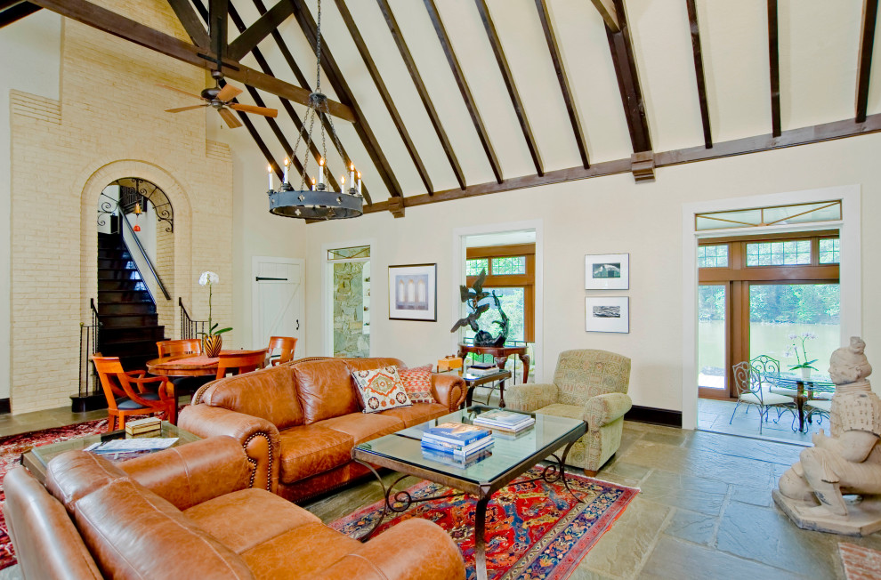 Country formal enclosed living room in Baltimore with beige walls, slate floors, multi-coloured floor and vaulted.