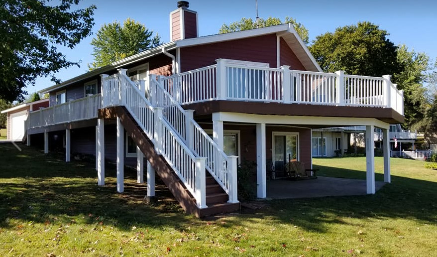 Deck - large country backyard deck idea in Chicago with no cover