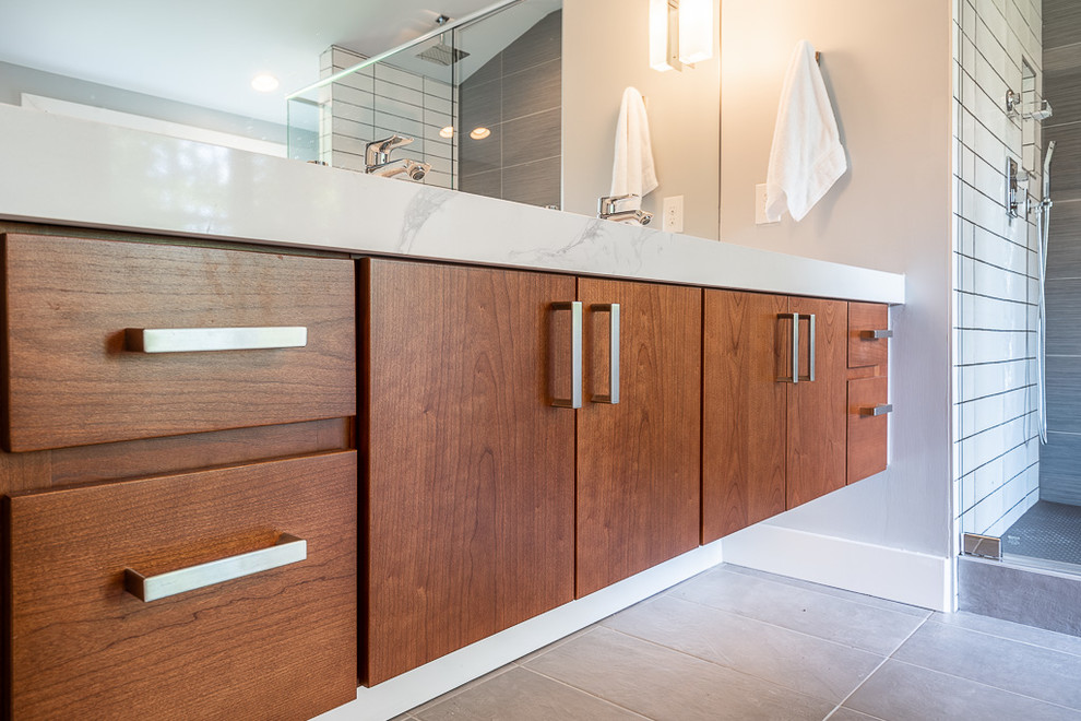 Large midcentury master bathroom in Atlanta with medium wood cabinets, a double shower, white tile, porcelain tile, engineered quartz benchtops and white benchtops.