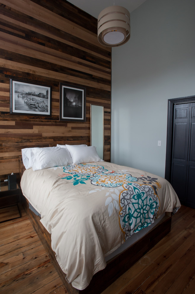 Photo of a contemporary bedroom in Other with grey walls and dark hardwood floors.