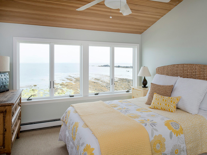 This is an example of a beach style bedroom in Portland Maine.