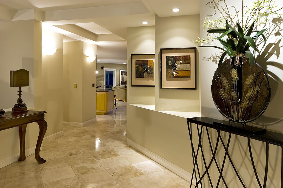Design ideas for a large contemporary foyer in San Francisco with beige walls and marble floors.