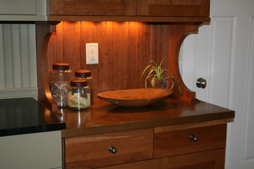 Mid-sized transitional l-shaped medium tone wood floor eat-in kitchen photo with a farmhouse sink, flat-panel cabinets, medium tone wood cabinets, copper countertops, stainless steel appliances, no island and brown backsplash