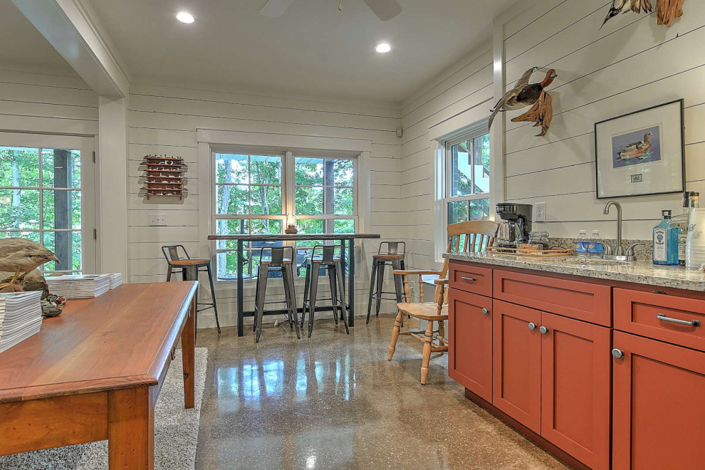 Photo of a small country single-wall eat-in kitchen in Other with medium wood cabinets, granite benchtops, shiplap splashback, stainless steel appliances, concrete floors, no island and grey benchtop.