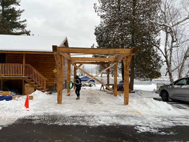 Log Siding, Stamped Concrete and Post and Beam Carport