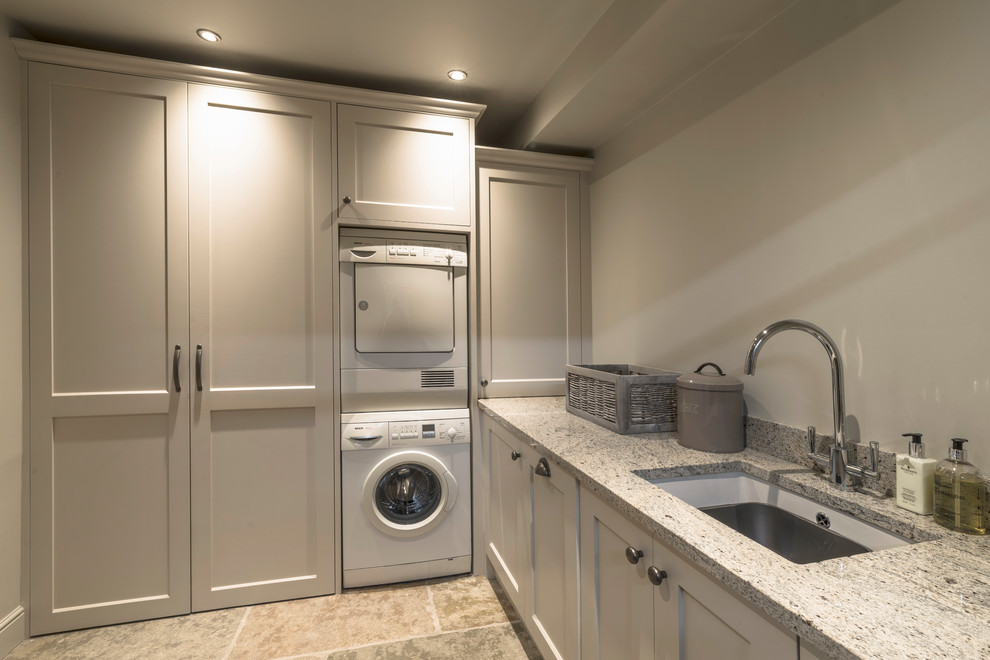 Transitional laundry room in Manchester.