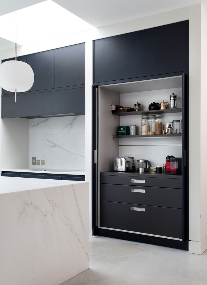 Design ideas for a modern l-shaped open plan kitchen in Other with a drop-in sink, flat-panel cabinets, blue cabinets, marble benchtops, white splashback, marble splashback, black appliances, concrete floors, with island, grey floor and white benchtop.
