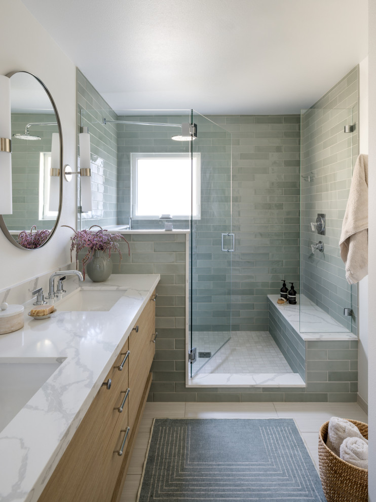 Inspiration for a mid-sized contemporary master green tile and ceramic tile porcelain tile, beige floor and double-sink double shower remodel in Seattle with flat-panel cabinets, light wood cabinets, a one-piece toilet, white walls, an undermount sink, quartz countertops, a hinged shower door, white countertops and a floating vanity