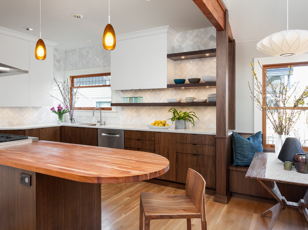 Inspiration for a mid-sized midcentury l-shaped eat-in kitchen in Seattle with quartz benchtops, white splashback, stone tile splashback, stainless steel appliances, medium hardwood floors, a double-bowl sink, dark wood cabinets, with island and flat-panel cabinets.
