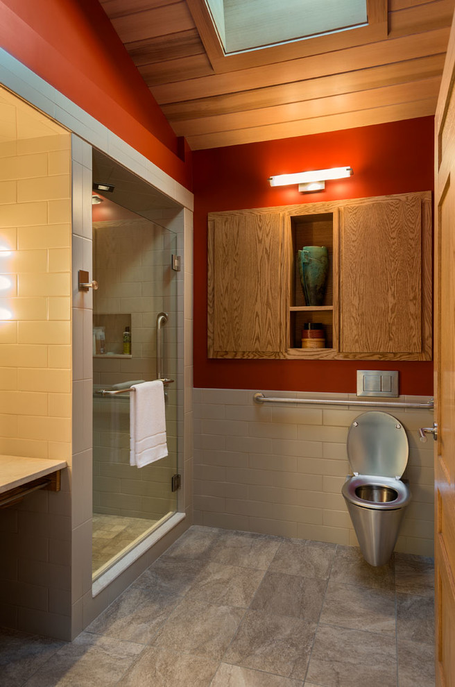 This is an example of a midcentury bathroom in Burlington with an alcove shower, a wall-mount toilet, white tile, subway tile and red walls.