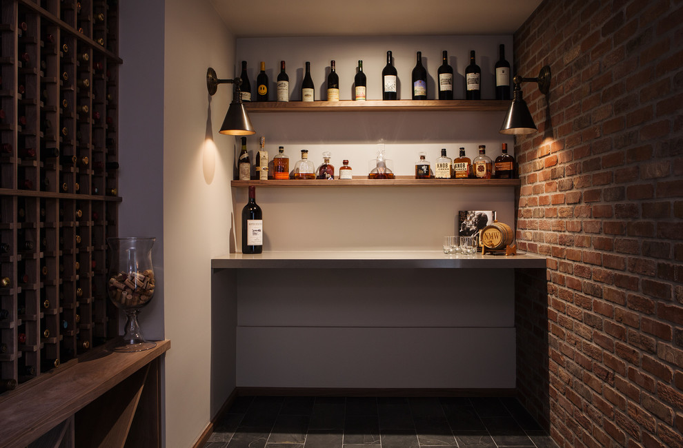 Design ideas for a small transitional wine cellar in San Francisco with storage racks.