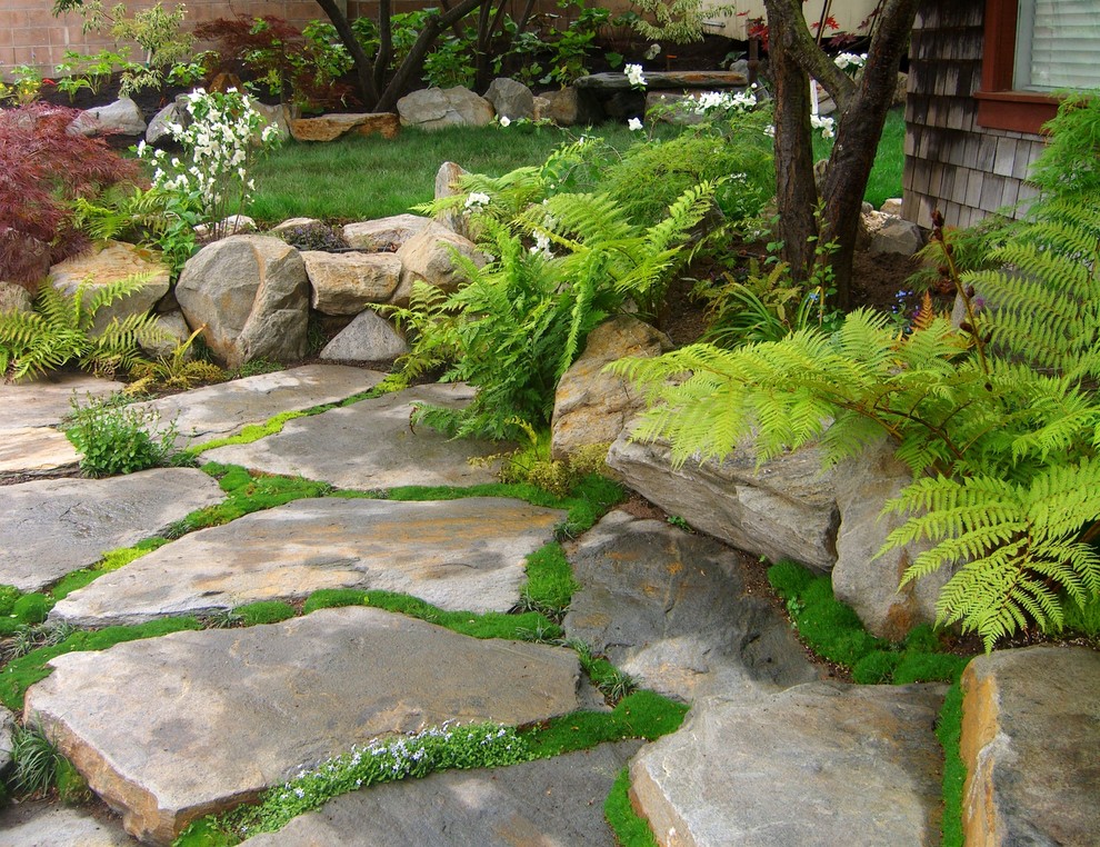 Design ideas for a small asian backyard patio in San Luis Obispo with a water feature, natural stone pavers and no cover.