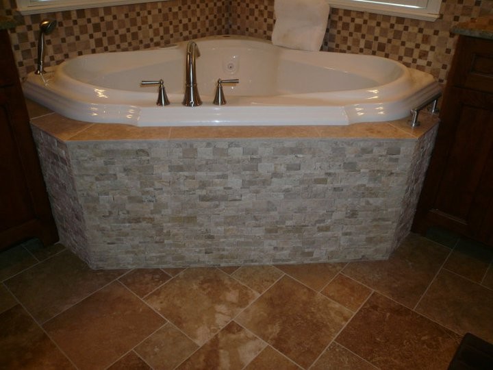 Mid-sized transitional master bathroom in St Louis with a curbless shower, white tile, ceramic tile and concrete floors.