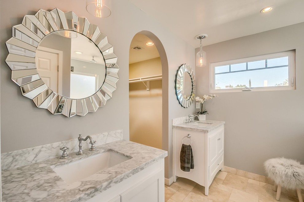 Example of a large transitional master bathroom design in Phoenix with white cabinets, gray walls, an undermount sink and marble countertops