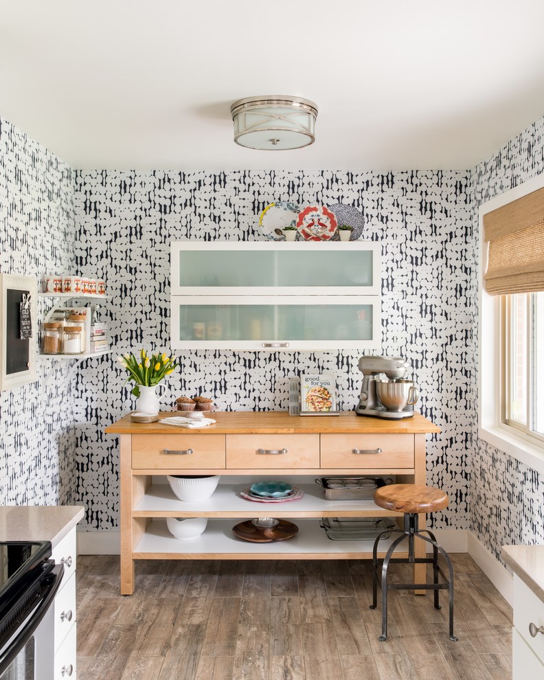 Example of a transitional light wood floor kitchen design in Denver with open cabinets and wood countertops