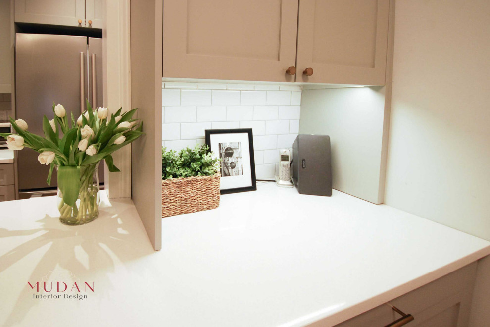 Eat-in kitchen - small transitional galley medium tone wood floor eat-in kitchen idea with a farmhouse sink, shaker cabinets, gray cabinets, quartz countertops, white backsplash, ceramic backsplash, stainless steel appliances, a peninsula and white countertops
