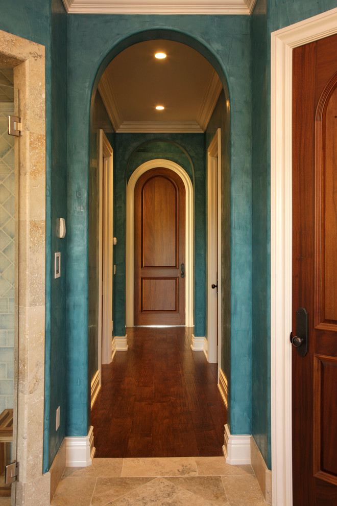 Inspiration for a mediterranean hallway in Orlando with blue walls.