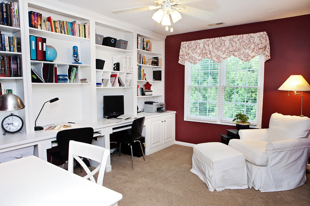Home office - mid-sized transitional built-in desk carpeted and brown floor home office idea in Raleigh with red walls and no fireplace