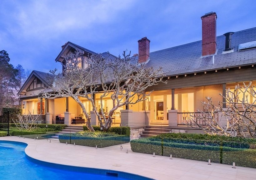 Inspiration for a large traditional two-storey brick beige house exterior in Sydney with a gable roof and a tile roof.
