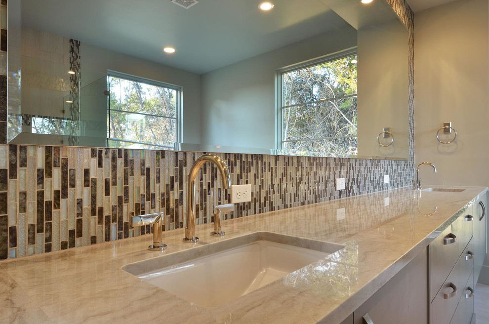 Inspiration for a transitional bathroom in Austin with quartzite benchtops, multi-coloured tile, mosaic tile, beige walls and an undermount sink.