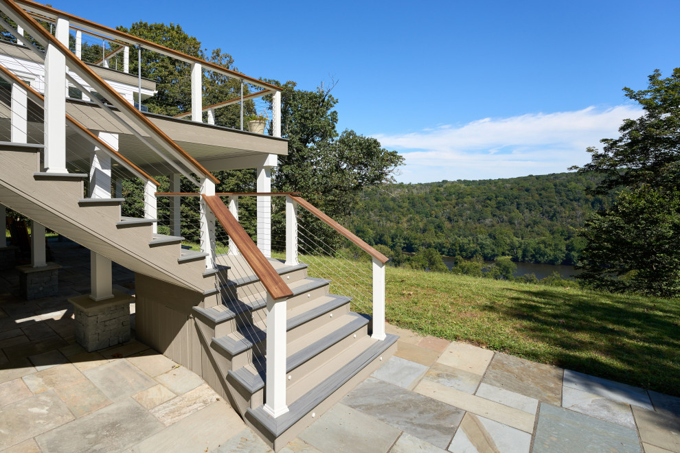 Inspiration for an expansive contemporary backyard and first floor deck in Philadelphia with no cover and cable railing.