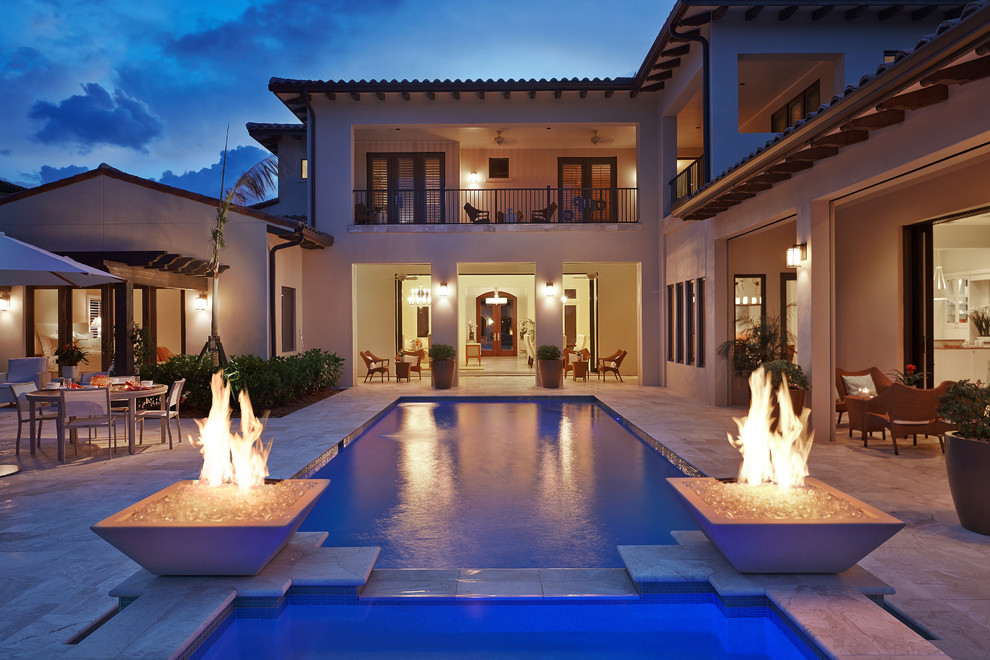 Inspiration for a mediterranean backyard rectangular pool in Miami.