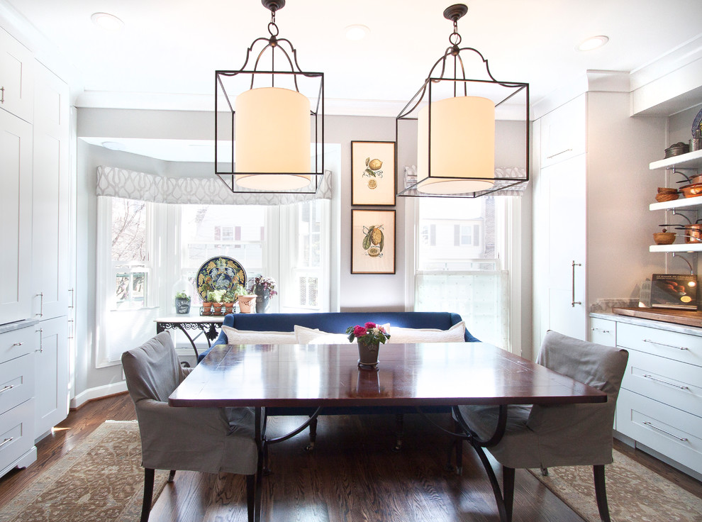 Small transitional eat-in kitchen photo in DC Metro with white cabinets and marble countertops