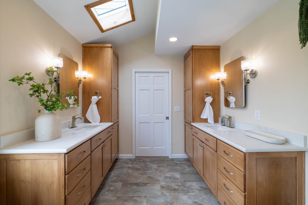 Arts and crafts master beige tile brown floor and single-sink bathroom photo in Other with light wood cabinets, a bidet, beige walls, an undermount sink, white countertops and a niche