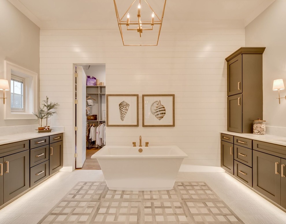 Photo of an expansive traditional master bathroom in Other with shaker cabinets, grey cabinets, a freestanding tub, grey walls, marble floors, an undermount sink, marble benchtops, grey floor, a curbless shower, a two-piece toilet, gray tile, cement tile and a hinged shower door.