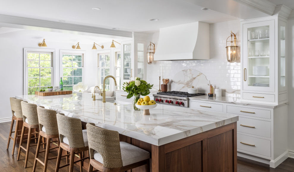 Inspiration for a transitional l-shaped dark wood floor eat-in kitchen remodel with a drop-in sink, shaker cabinets, white cabinets, marble countertops, marble backsplash, paneled appliances, an island and gray countertops