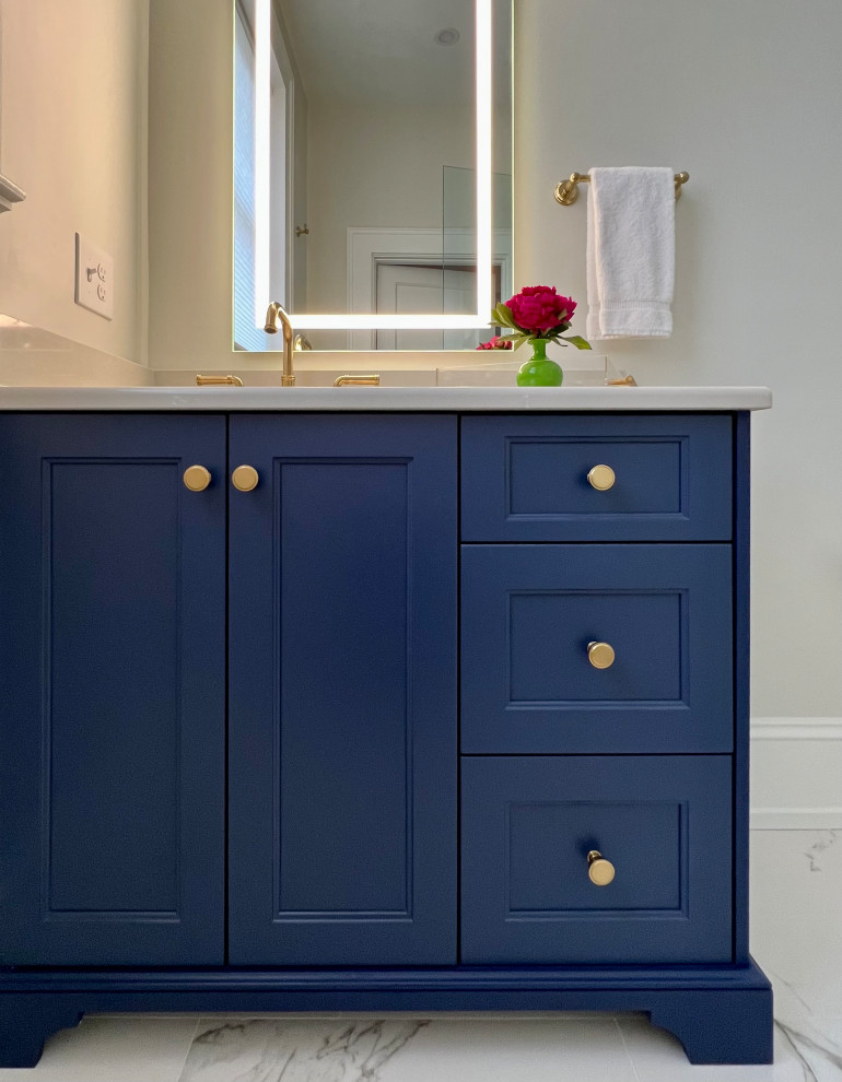 Transitional single-sink bathroom photo with blue cabinets