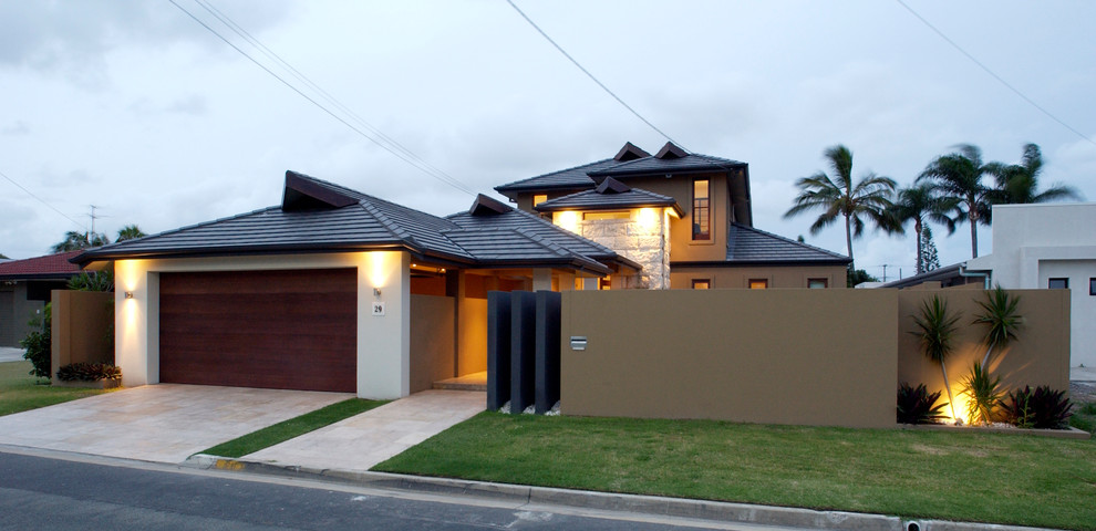 Design ideas for a large contemporary two-storey brown house exterior in Brisbane with mixed siding.