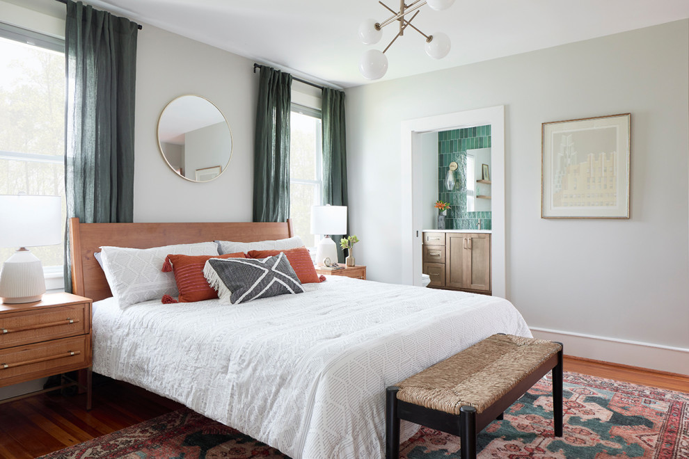 Inspiration for a large traditional master bedroom in Other with white walls, light hardwood flooring and brown floors.