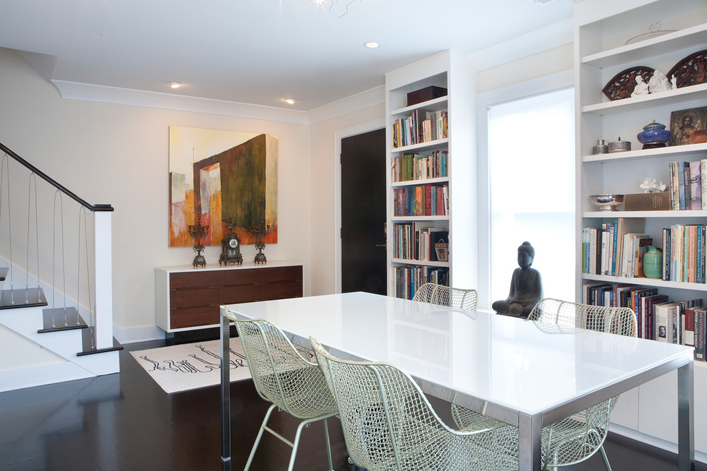 Inspiration for a small transitional dark wood floor and brown floor enclosed dining room remodel with white walls