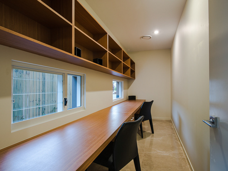 This is an example of a contemporary study room in Brisbane with a built-in desk.