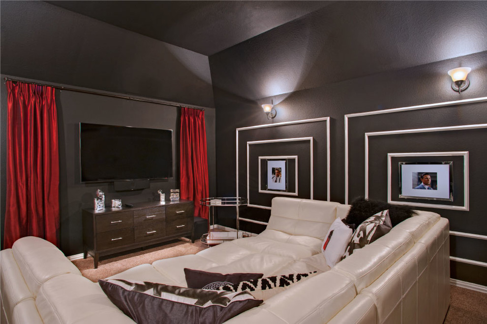 Design ideas for a large transitional enclosed home theatre in Houston with black walls, carpet and a wall-mounted tv.