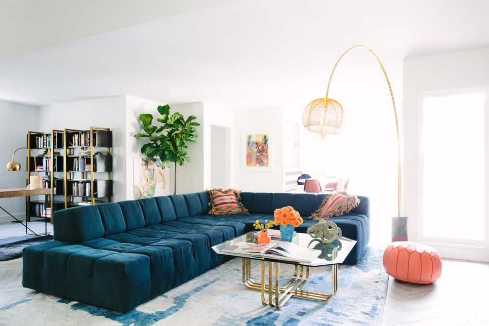 Example of a trendy open concept living room design in Los Angeles with white walls
