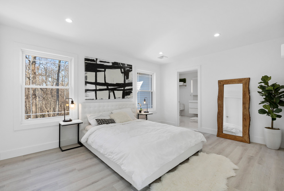 Modern Residential Construction - Large minimalist master light wood floor, brown floor, shiplap ceiling and wall paneling bedroom photo in Newark with white walls