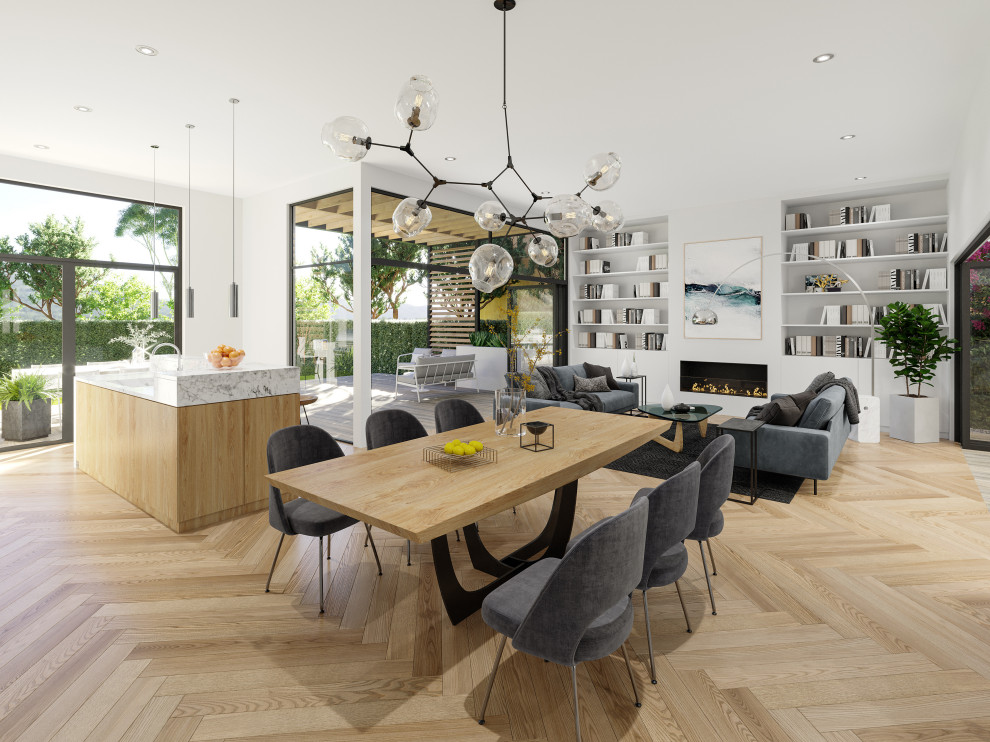 Example of a mid-sized minimalist light wood floor and beige floor kitchen/dining room combo design in Los Angeles with white walls, a standard fireplace and a plaster fireplace