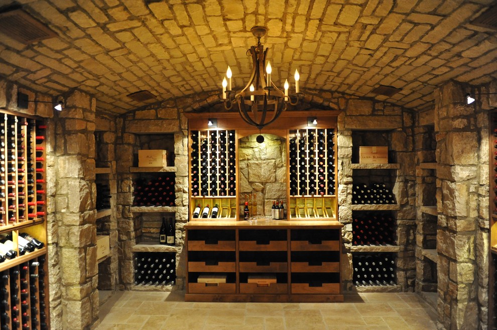 Mid-sized mountain style ceramic tile and yellow floor wine cellar photo in Orange County with storage racks
